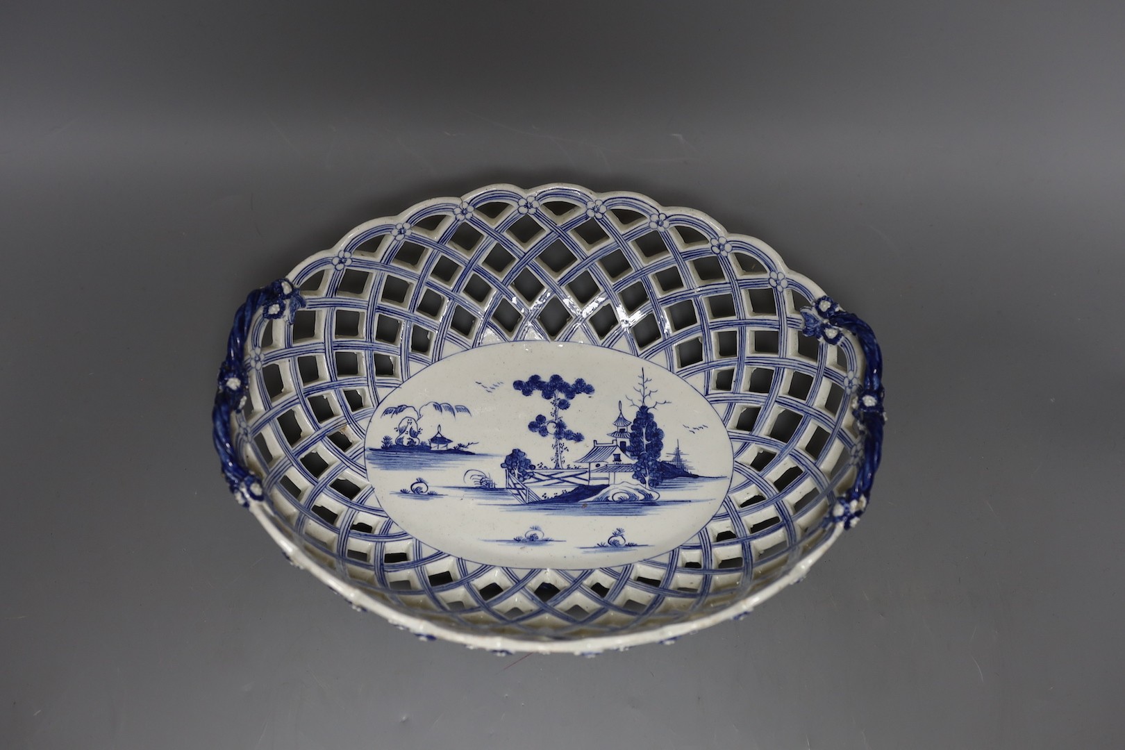 A Derby large size oval two handled basket painted in blue with a chinoiserie scene c. 1770 27cm